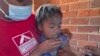 A child receives a measles vaccination jab at a clinic in Harare, Zimbabwe, Sept. 6, 2022.