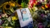 Floral tributes and a farewell message to Queen Elizabeth II are seen outside Holyrood Palace in Edinburgh, Scotland, Sept. 10, 2022.