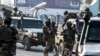 FILE - Afghan security personnel arrive at the Kabul airport in Kabul, Feb. 12, 2024. The Taliban government confirmed, March 31, 2024, they had detained 'a number of foreign citizens, including two Americans' for allegedly violating their laws. 
