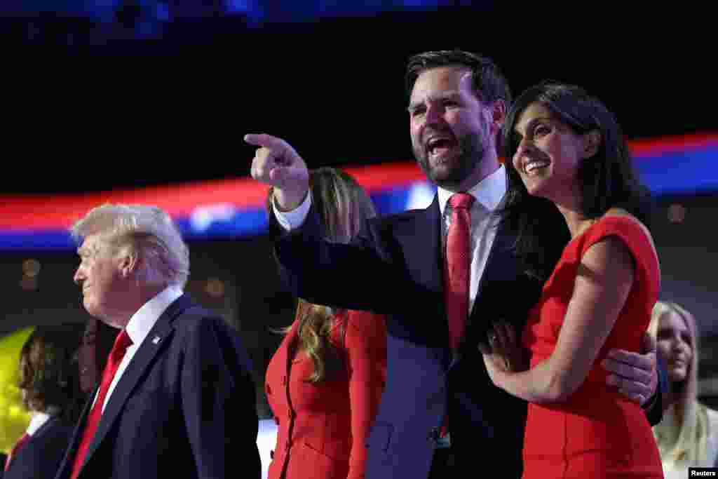 Republican vice presidential nominee J.D. Vance and his wife Usha Chilukuri Vance are seen on stage on Day 4 of the Republican National Convention at the Fiserv Forum in Milwaukee, July 18, 2024. 