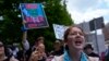 Sarah Carter, who opposes abortion rights, speaks near the Fiserv Forum during the first day of the 2024 Republican National Convention, July 15, 2024, in Milwaukee.