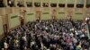 FILE - Poland's lawmakers vote in parliament, in Warsaw, May 26, 2023. 