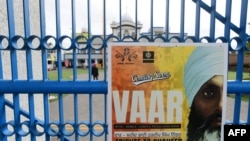 FILE - A poster advertising a tribute for Hardeep Singh Nijjar is displayed at the Guru Nanak Sikh Gurdwara temple in Surrey, British Columbia, Canada, on Sept. 19, 2023. 