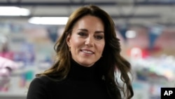 FILE - Britain's Kate, Princess of Wales smiles during her visit to Sebby's Corner in north London, Nov. 24, 2023. She revealed Friday that she was undergoing preventative chemotherapy in a video message to the UK,
