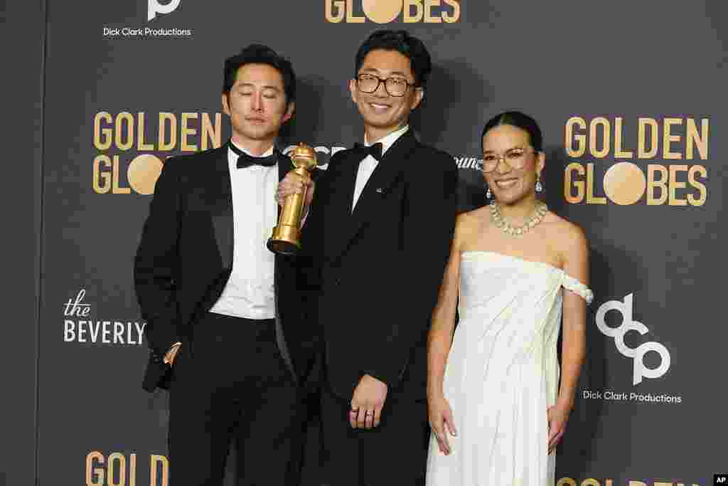 Steve Yeun, from left, Lee Sung Jin, and Ali Wong pose in the press room with the award for best television limited series, anthology series or motion picture made for television for "Beef" at the 81st Golden Globe Awards on Jan. 7, 2024, 