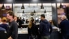 FILE - People buy recreational marijuana at the Apothecarium marijuana dispensary on the first day recreational sales are allowed for customers over the age of 21, in Maplewood, New Jersey, April 21, 2022.