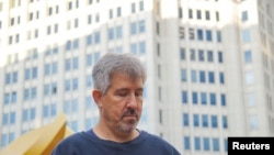 Former Wall Street Journal reporter Jay Solomon poses for photograph in front of a building in Bethesda, Maryland, US, Sept. 28, 2022