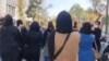 A screengrab from video posted to Twitter on Oct. 8, 2022, by @1500tasvir purports to show Iranian women marching in an anti-government protest.