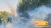 FILE - In this Oct. 1, 2022, photo taken by an individual not employed by the Associated Press and obtained by the AP outside Iran, tear gas is fired by security to disperse protesters in front of the Tehran University, Iran. 