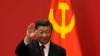 FILE - Chinese President Xi Jinping waves at the Great Hall of the People in Beijing on Oct. 23, 2022. After he was named to another term as head of the ruling Communist Party, Xi strengthened his grip on China's military command.