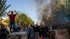 In this photo taken by an individual not employed by the Associated Press and obtained by the AP outside Iran, Iranians protests the death of 22-year-old Mahsa Amini after she was detained by the morality police last month, in Tehran, Oct. 27, 2022. 
