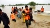 Army troops evacuate people from a flood-hit area in Rajanpur, district of Punjab, Pakistan, Aug. 27, 2022.