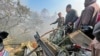 Rescuers gather at the site of a plane crash in Pokhara, Nepal, on Jan. 15, 2023. 