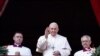 Pope Francis waves as he delivers his traditional Christmas Day Urbi et Orbi message to the city and the world from the main balcony of St. Peter's Basilica at the Vatican, Dec. 25, 2022. 