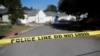 Sahalee Way in Raleigh, N.C., remains closed on Oct. 14, 2022, following a shooting the day before. Police say a 15-year-old boy fatally shot at least two people in a neighborhood, then fled toward a walking trail where he opened fire, killing and wounding others.