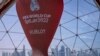 A count down clock is displayed at the seafront in Doha, Qatar, Tuesday, March 29, 2022. Qatar's residents squeezed as World Cup rental demand soars. (AP Photo/Darko Bandic, File)