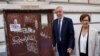 Austrian President Alexander Van der Bellen walks outside the polling station with his wife Doris Schmidauer during presidential elections in Vienna, Austria, Oct. 9, 2022. 