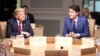 Canada's Prime Minister Justin Trudeau (R) and U.S. President Donald Trump participate in the working session at the G7 Summit in the Charlevoix town of La Malbaie, Quebec, Canada, June 8, 2018. 