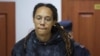 FILE - U.S. basketball player Brittney Griner, who was detained at Moscow's Sheremetyevo airport and later charged with illegal possession of cannabis, is escorted before a court hearing in Khimki outside Moscow, Russia July 26, 2022