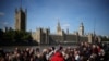 Members of the public line up as they wait to view Queen Elizabeth II's lying in state ahead of her funeral on Monday, in London, Sept. 17, 2022. 