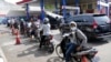 Motorists queue up to fill up their tanks after the government announced an increase in fuel prices, at a gasoline station in Jakarta, Indonesia, Sept. 3, 2022. 
