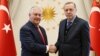 U.S. Secretary of State Rex Tillerson (left) poses with Turkey's President Recep Tayyip Erdogan before their meeting in Ankara, Turkey, March 30, 2017.