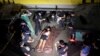 FILE - The body of a man who police said was killed during a drug bust operation on "shabu" (meth) is seen in Manila, Philippines, August 18, 2016.