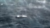A handout photo taken released on March 2, 2025, by the Australian Department of Defence shows an image taken in the Coral Sea from a Royal Australian Air Force aircraft as it flies above the vessel of Aurimas Mockus from Lithuania.