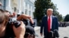 President Donald Trump talks to reporters on the South Lawn of the White House, Aug. 9, 2019.