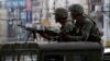 FILE - Members of the Philippine Marines hold their weapons in southern Philippines, Sept. 15, 2013.