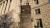 FILE - The Department of Commerce building is seen before an expected report of new home sales numbers in Washington, Jan. 26, 2022.