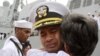 U.S. navy officer Michael "Vannak Khem" Misiewicz becomes emotional as he embraces his aunt Samrith Sokha, 72, at Cambodian coastal international sea port of Sihanoukville.