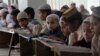 Pakistani children attend lessons at a madrassa, or a religious school, to learn Quran, in Karachi, Pakistan, Sept. 2, 2015. 