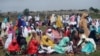 Muslims perform an Eid al-Fitr prayer in an outdoor open area in Lagos, Nigeria, May 13, 2021.