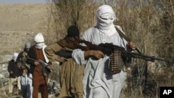 Taliban fighters pose with weapons in an undisclosed location in Nangarhar province (file photo)