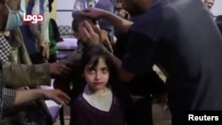 Une victime de l’attaque présumée d'armes chimiques, Douma, Syrie, le 8 avril 2018. 