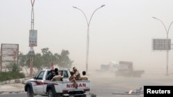 Members of UAE-backed southern Yemeni separatist forces patrol a road during clashes with government forces in Aden, Yemen, Aug. 10, 2019.
