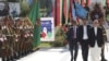 In this photo released by the Afghan Presidential Palace, Afghan President Ashraf Ghani, right, inspects the guard of honor during Independence Day celebrations at Defense Ministry in Kabul, Afghanistan, Monday, Aug. 19, 2019. Afghanistan's president is v