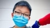 Caleb Chung menerima dosis pertama vaksin COVID-19 buatan Pfizer dalam uji klinis untuk anak-anak usia 12-15, di Duke University Health System di Durham, N.C. (Foto: Richard Chung via AP)