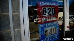 A sign advertising the next Powerball and Mega Millions jackpots at the KC Mart in Simpsonville, S.C., Oct. 24, 2018. 
