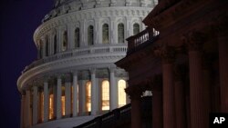FILE - Light shines on the U.S. Capitol dome on Capitol Hill in Washington, Dec. 13, 2019. 