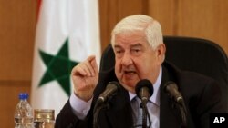 Menteri Luar Negeri Suriah Walid al-Moallem dalam sebuah konferensi pers di Damaskus. (Foto: Dok)