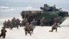 FILE - U.S. Marines with Amphibious Assault Vehicles take a part in a landing operation during a military Exercise Baltops 2018 at the Baltic Sea, some 340 kms (211 miles) west north of the capital Vilnius, Lithuania, June 4, 2018.