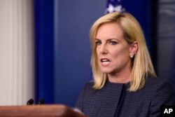 FILE - Department of Homeland Security Secretary Kirstjen Nielsen speaks at the White House in Washington, June 18, 2018. Nielson was heckled at a restaurant near the White House for defending President Donald Trump's now reversed family separation policy at U.S. borders.
