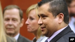 George Zimmerman leaves court with his family after Zimmerman's not guilty verdict was read in Seminole Circuit Court in Sanford, Florida, July 13, 2013. 