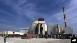 The reactor building of the Bushehr nuclear power plant is seen, just outside the southern city. Iran began loading fuel into the core of its first atomic power plant on Tuesday, moving closer to the start up of a facility that leaders have touted as defy