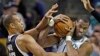 Boston Celtics center Jason Collins (r) struggles for control of the ball with Sacramento Kings' forward Chuck Hayes (42) during the second half of an NBA basketball game in Boston, Jan. 30, 2013. 