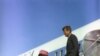 President and Mrs. Kennedy descend the stairs from Air Force One at Love Field in Dallas, TX, 22 November 1963.