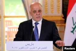Iraqi Prime minister Haider Al-Abadi speaks during a joint news conference with French President Emmanuel Macron (not seen) at the Elysee Palace in Paris, France, Oct. 5, 2017.
