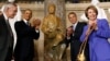 U.S. President Barack Obama (C) applauds after the unveiling of the Rosa Parks statue in the U.S. Capitol in Washington, Feb. 27, 2013. 